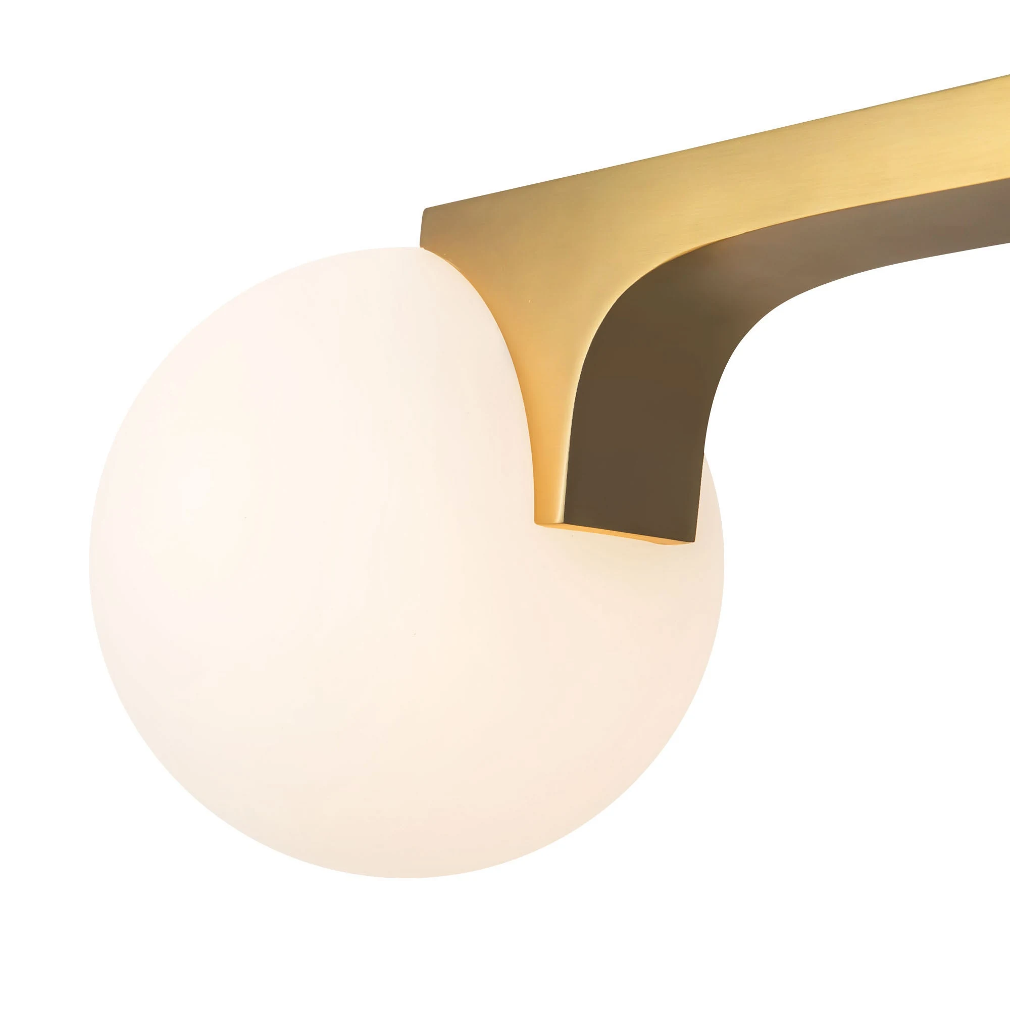 The Briar linear pendant’s curved arm appears to grasp the opal glass globe