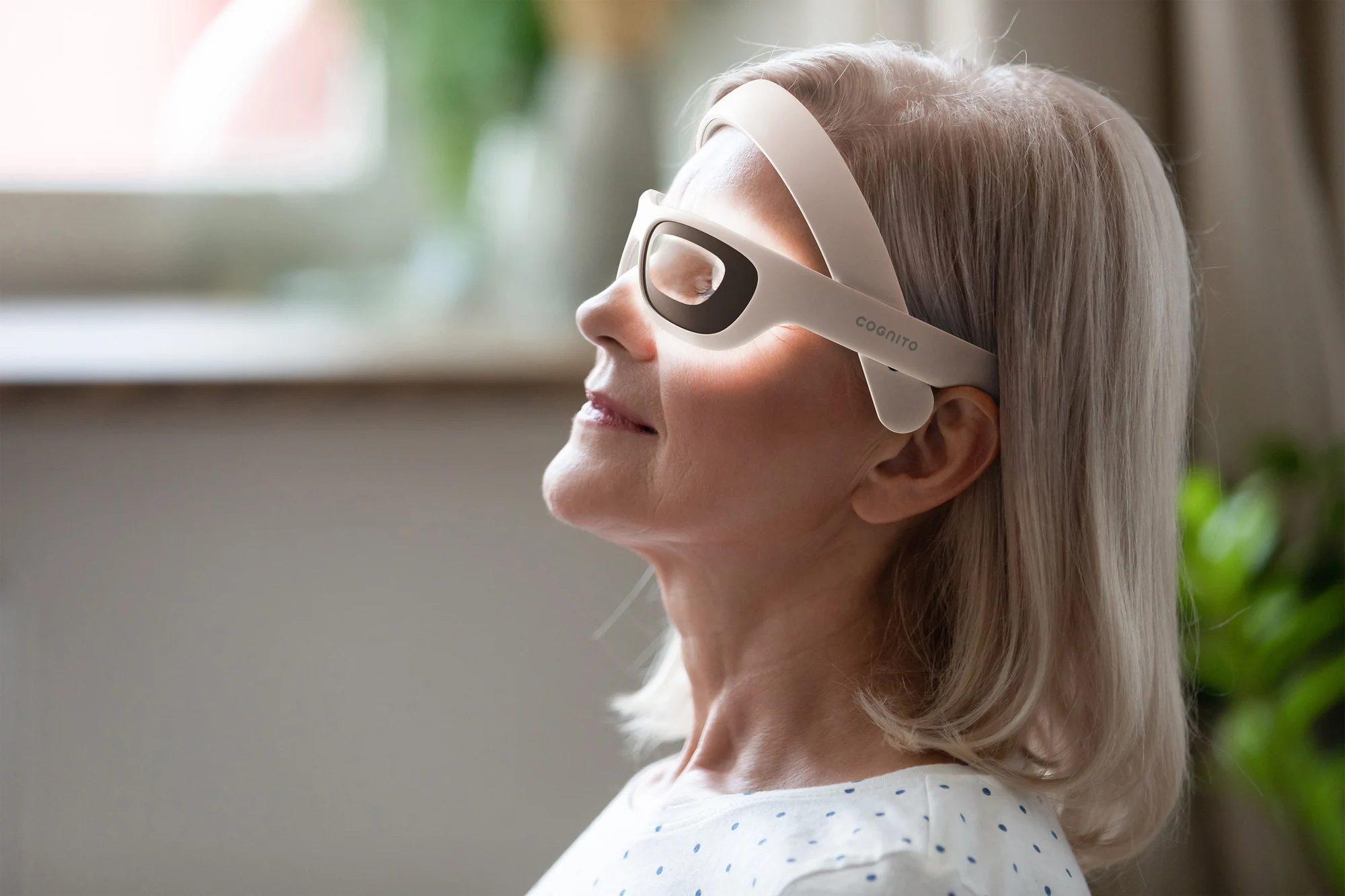 Side profile of a woman wearing Cognito, showing the eyepiece and headband